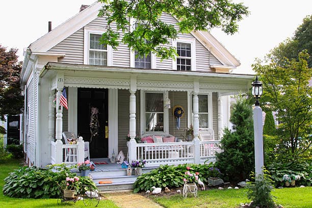 A well-kept home with a covered front porch